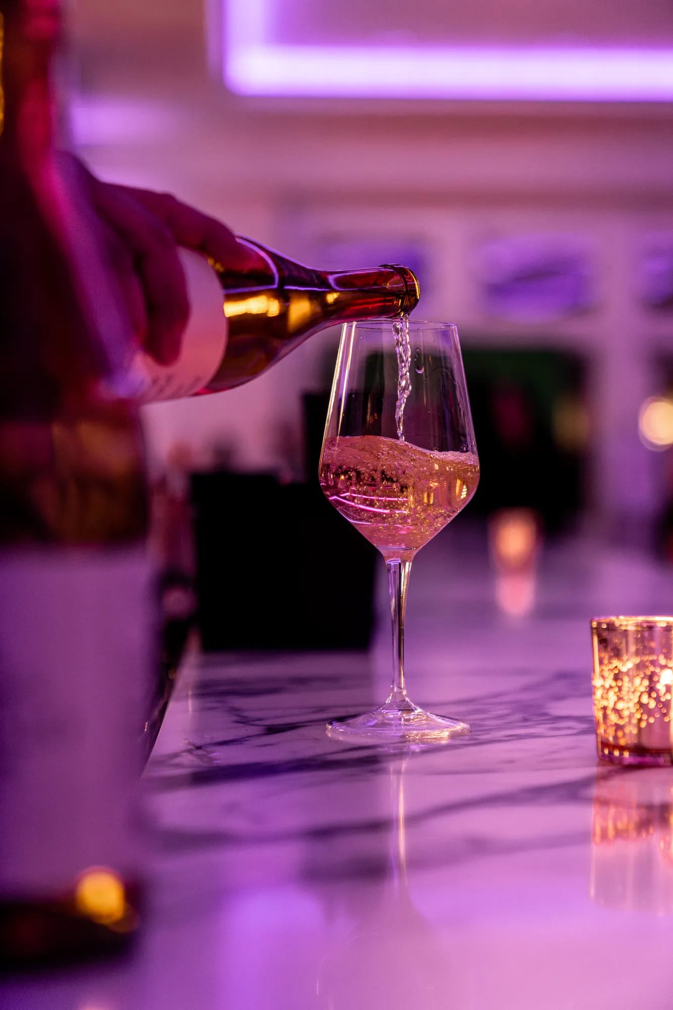 A glass of wine being poured at the marble bar at TillingHouse