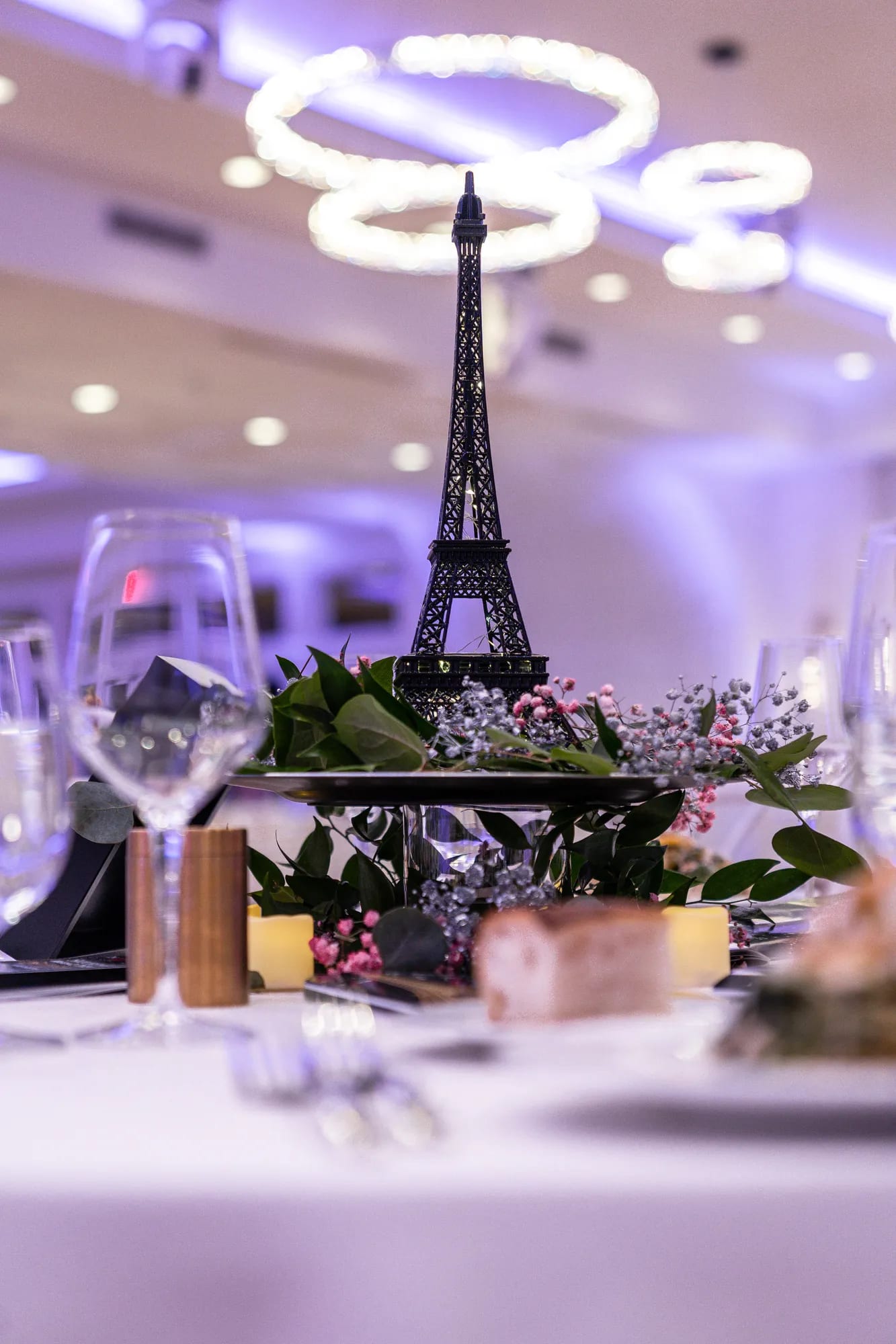An elegant table setting under ring chandeliers at a TillingHouse celebration