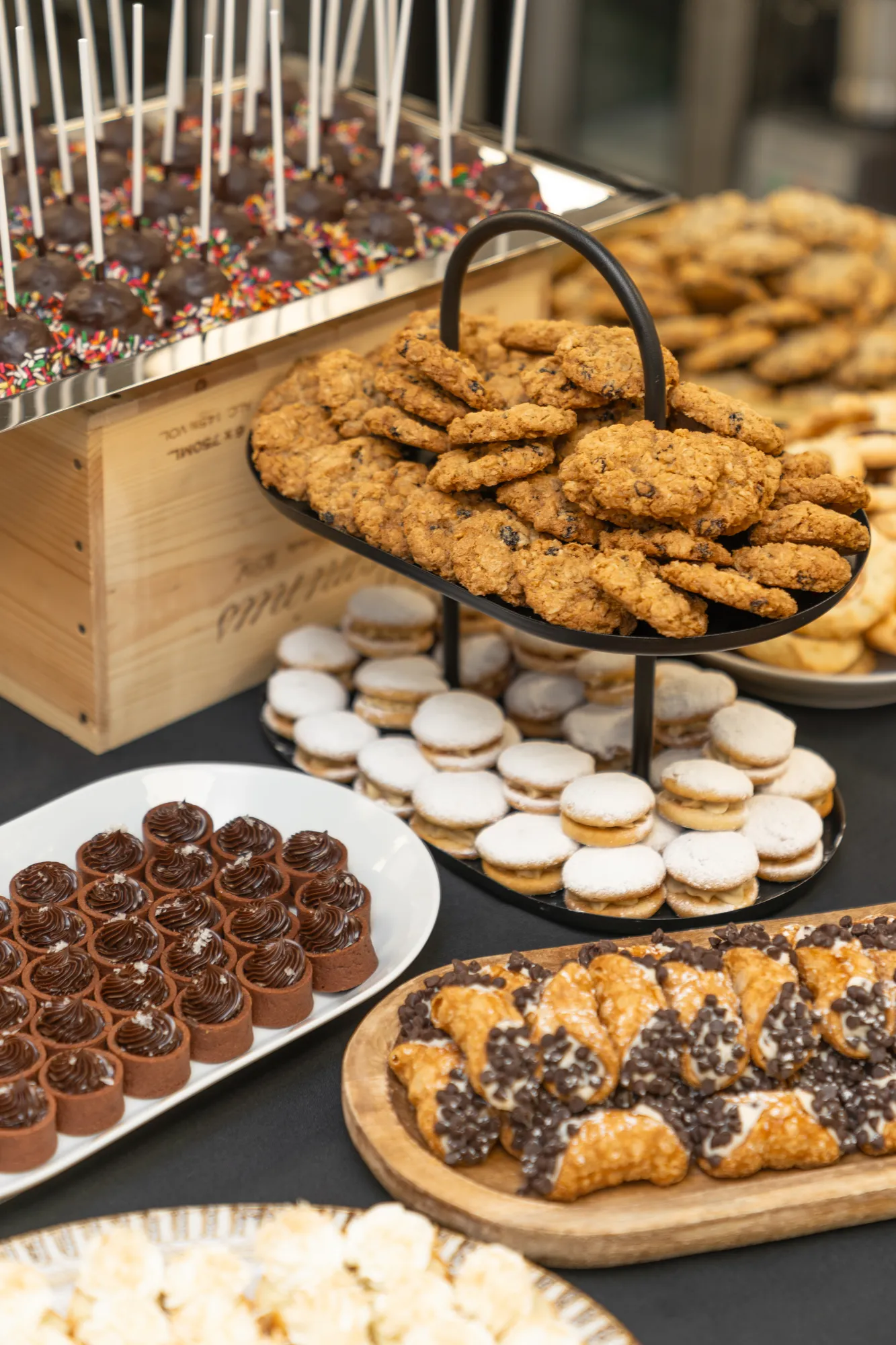 An abundant dessert display of cookies, macarons, and cake pops at TillingHouse