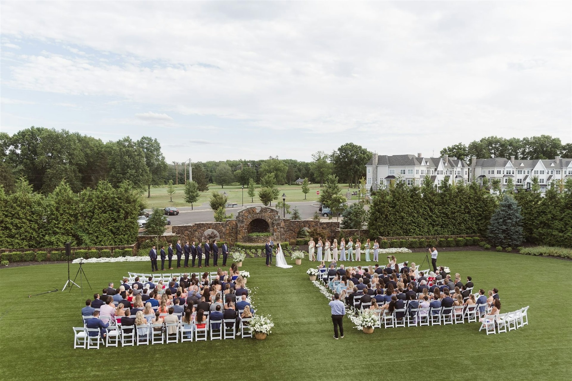 A garden wedding ceremony on the manicured golf-course lawn at TillingHouse