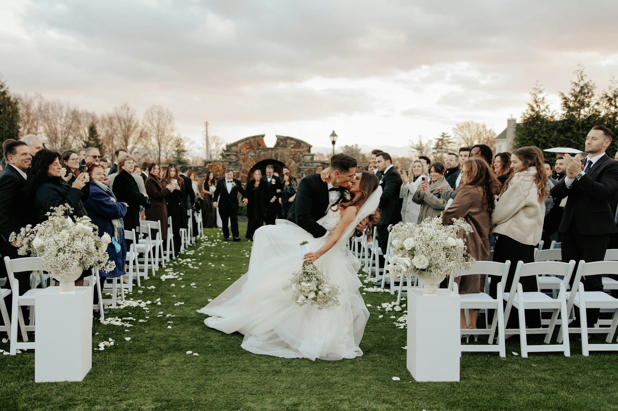 An outdoor wedding ceremony on the lawn at TillingHouse in Eatontown, New Jersey