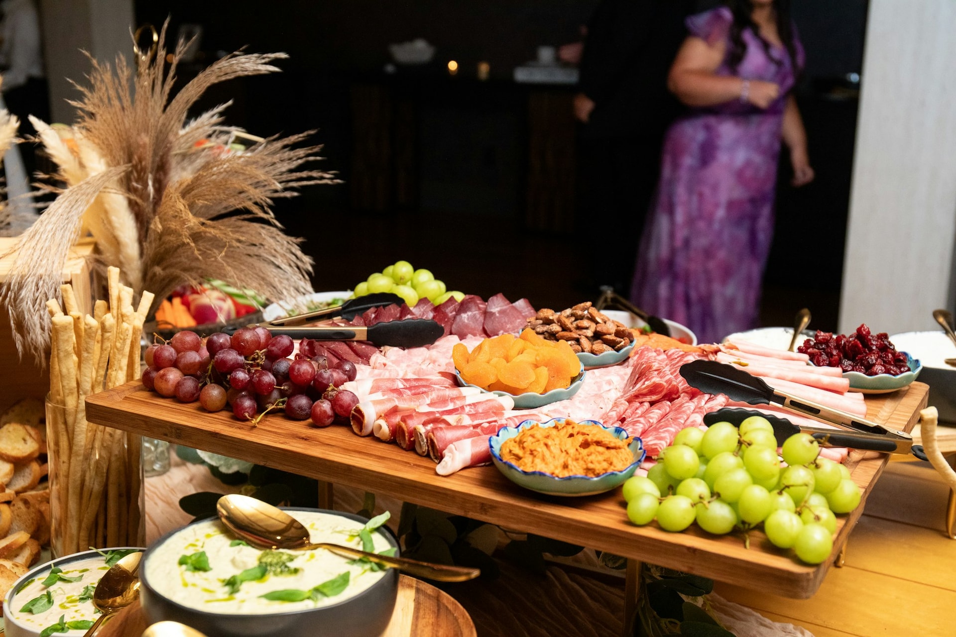 A grazing table of fresh fruit and charcuterie at a TillingHouse event