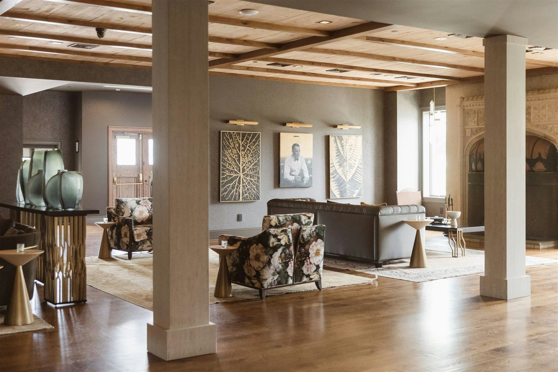 The wood-beamed parlor lounge with fireplace seating at TillingHouse