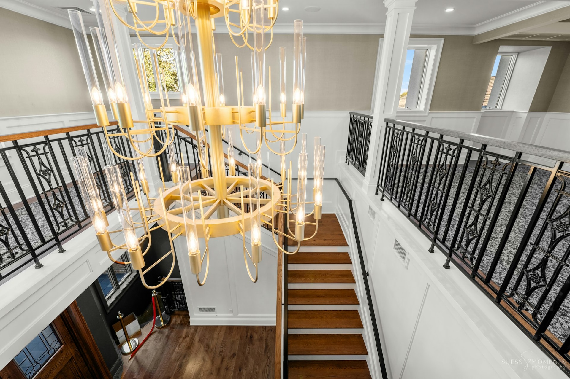 The grand staircase and chandelier at the historic TillingHouse mansion