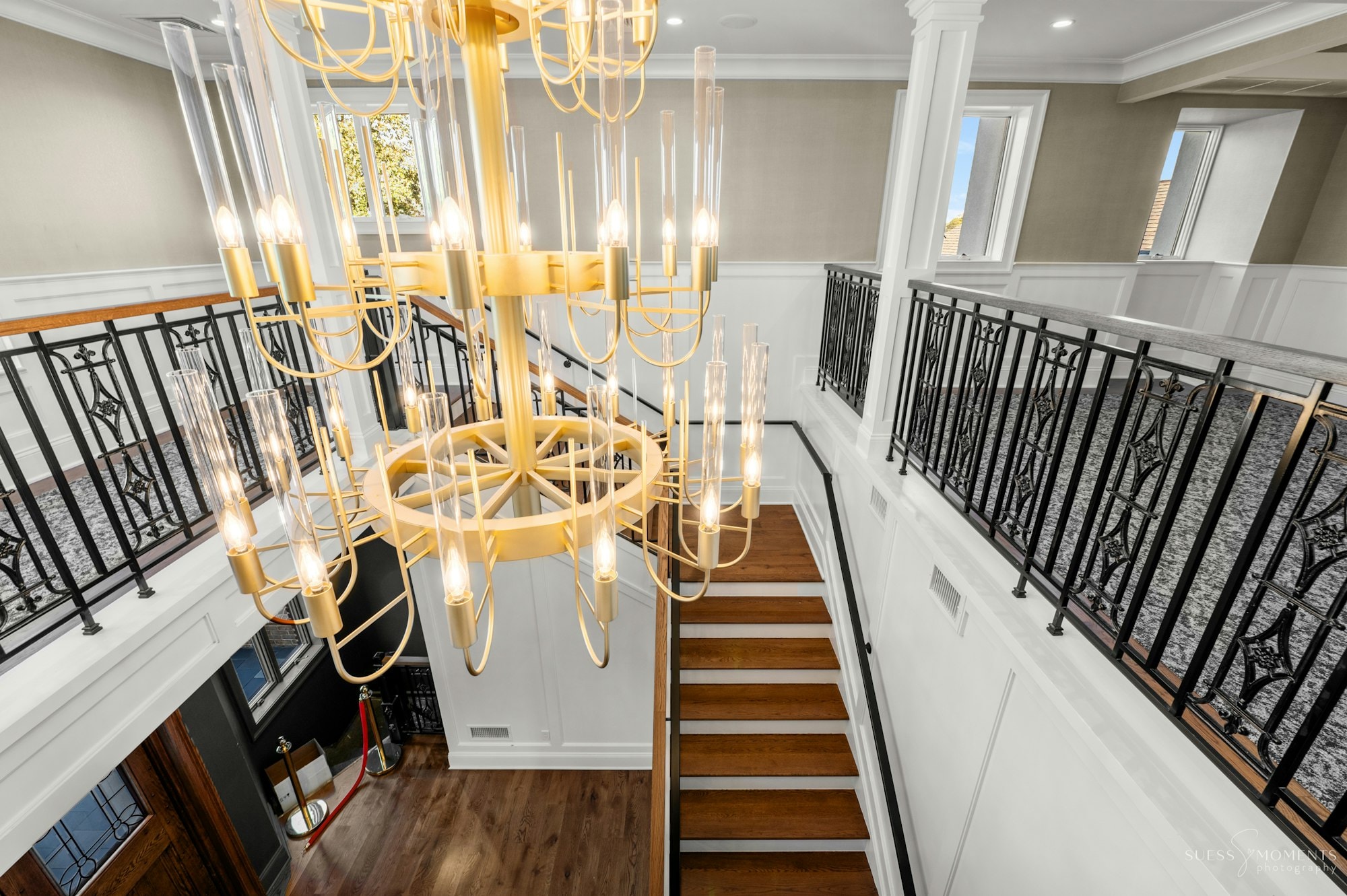 The grand staircase and chandelier at the historic TillingHouse mansion